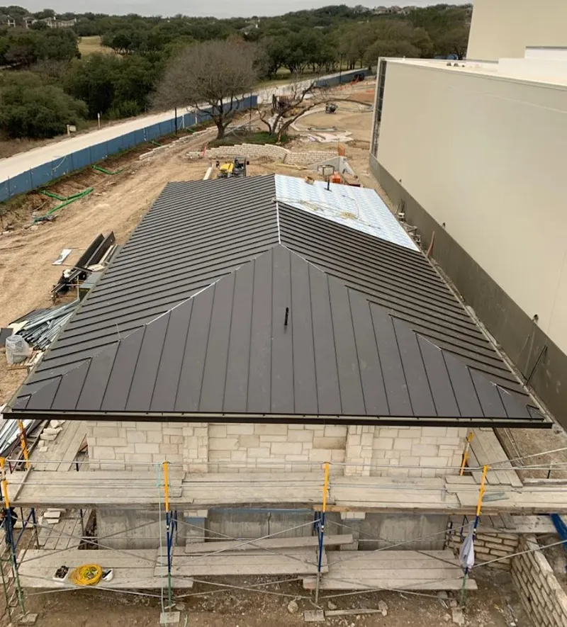 Metal roof new construction with scaffolding in Adelphi