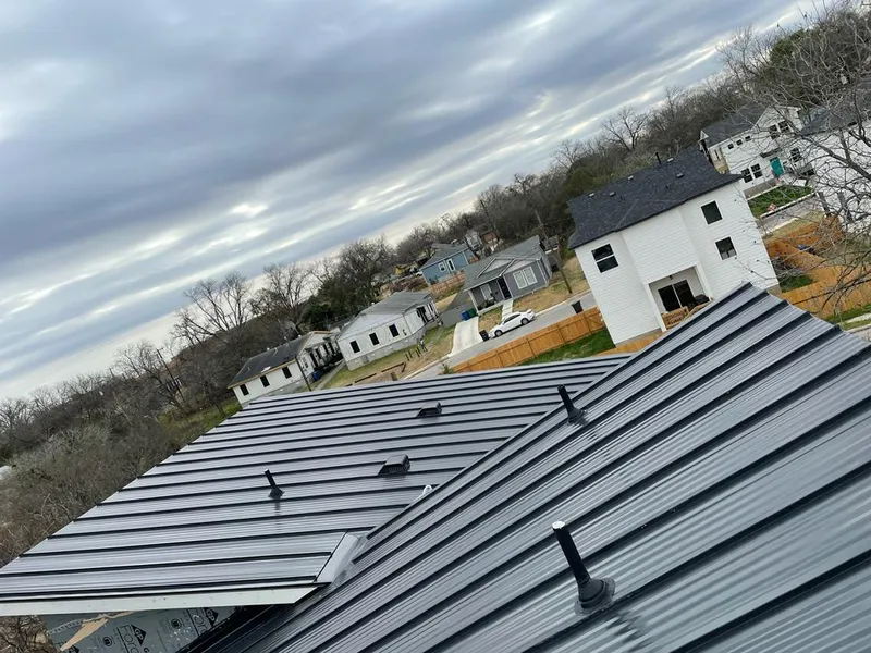 Standing seam metal roof panels with vents for Skylight Repair in Adelphi